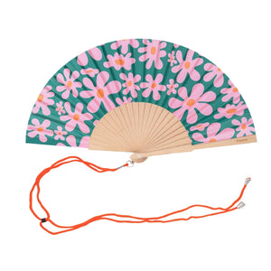 Open handheld fan with wooden ribs and pink and orange flowers on a green background. The fan is attached to an orange lanyard to wear around your neck. 