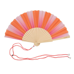Handheld fan with wooden ribs and a pink and orange striped design. The fan is attached to an orange lanyard to wear around your neck. 
