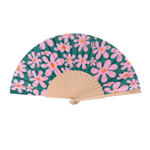Open handheld fan with wooden ribs and pink and orange flowers on a green background. 