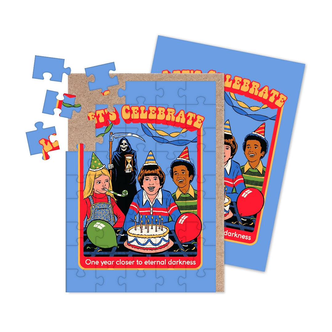 Puzzle greeting card with colorful party-themed graphics and the text "Let's Celebrate" and "One year closer to eternal darkness" on a blue background.