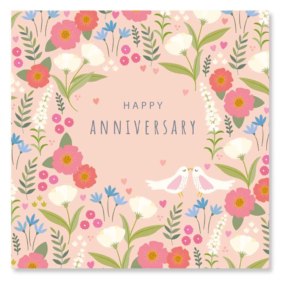 Greeting card featuring an illustration of flowers and two birds surrounding the text 'Happy Anniversary' on a pink background. 