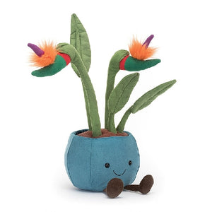 adorably soft plushie of a smiling flower pot with birds of paradise sprouting by popular brand Jellycat.