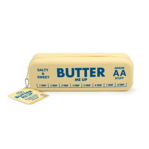 Yellow pouch in the shape and style of a stick of butter. The text 'Butter me up' is printed on it, along with 'Salty & Sweet', 'Grade AA stuff' and some measurements. The pouch is shown on a white background. 