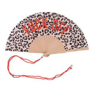 Open handheld fan with wooden ribs with the text 'FUCK OFF' on a leopard print background. The fan is attached to an orange lanyard to wear around your neck. 
