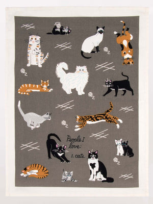 Image of a grey kitchen cloth with playful cat illustrations and the text 'People I Love: 1. Cats'.