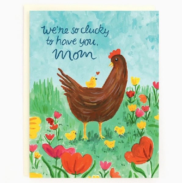 A Mother's Day card with an illustration of a chicken and chicks in a field of vibrant flowers, with the text 'We're so clucky to have you, Mom'.