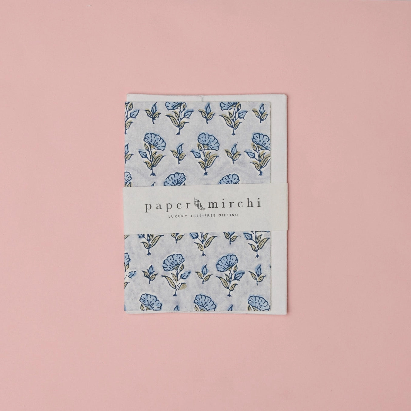 Cotton paper greeting card with a blue, green and gold botanical design on a pink background.