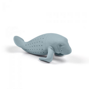 Image of a tea infuser in the style of a manatee against a white background. 