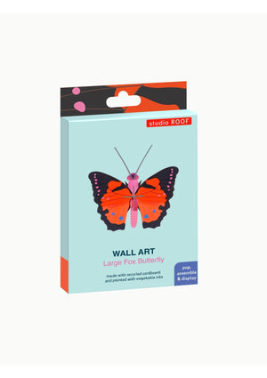 Packaging box for a large fox butterfly wall art kit from Studio Roof. The box features an image of a red, black and pink 3D butterfly on a blue background. 