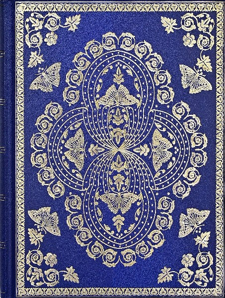 shiny indigo journal with intricate gold details that include butterflies and swirls
