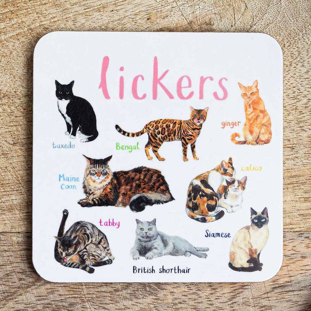 Coaster featuring illustrations of cats on a white background. Each cat is labelled, while the text 'Lickers' is printed on the top. The coaster sits on a wooden surface.