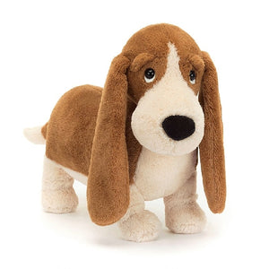 adorably soft plushie of a basset hound by popular brand Jellycat.