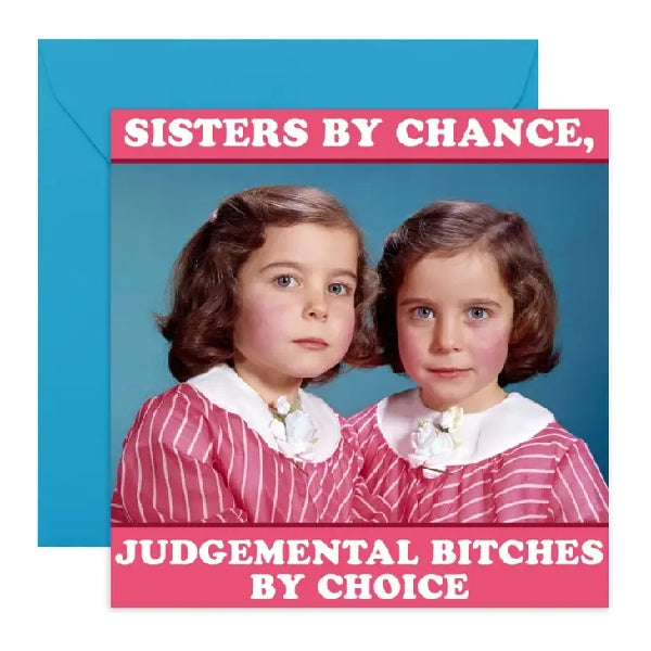 funny card with a picture of two young girls with the same bob and pink top. picture in the style of family or school pictures. top text reads "sisters by chance". bottom text reads "judgemental bitches by choice"