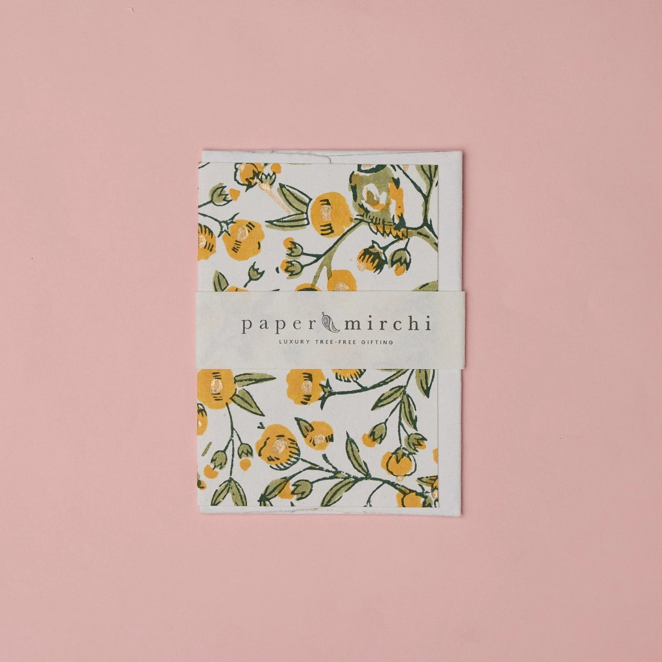 Cotton paper greeting card with a yellow, green and gold botanical and bird design on a white background. 