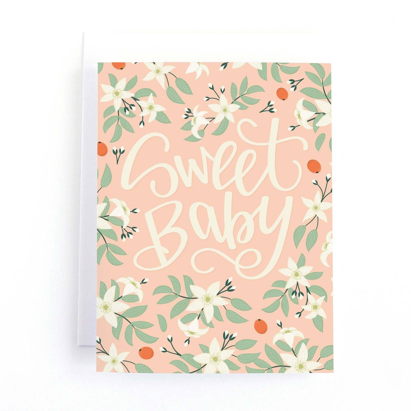 Greeting card featuring a white, green and orange botanical pattern on a light pink background. The text 'Sweet Baby' is printed across the centre of the card.
