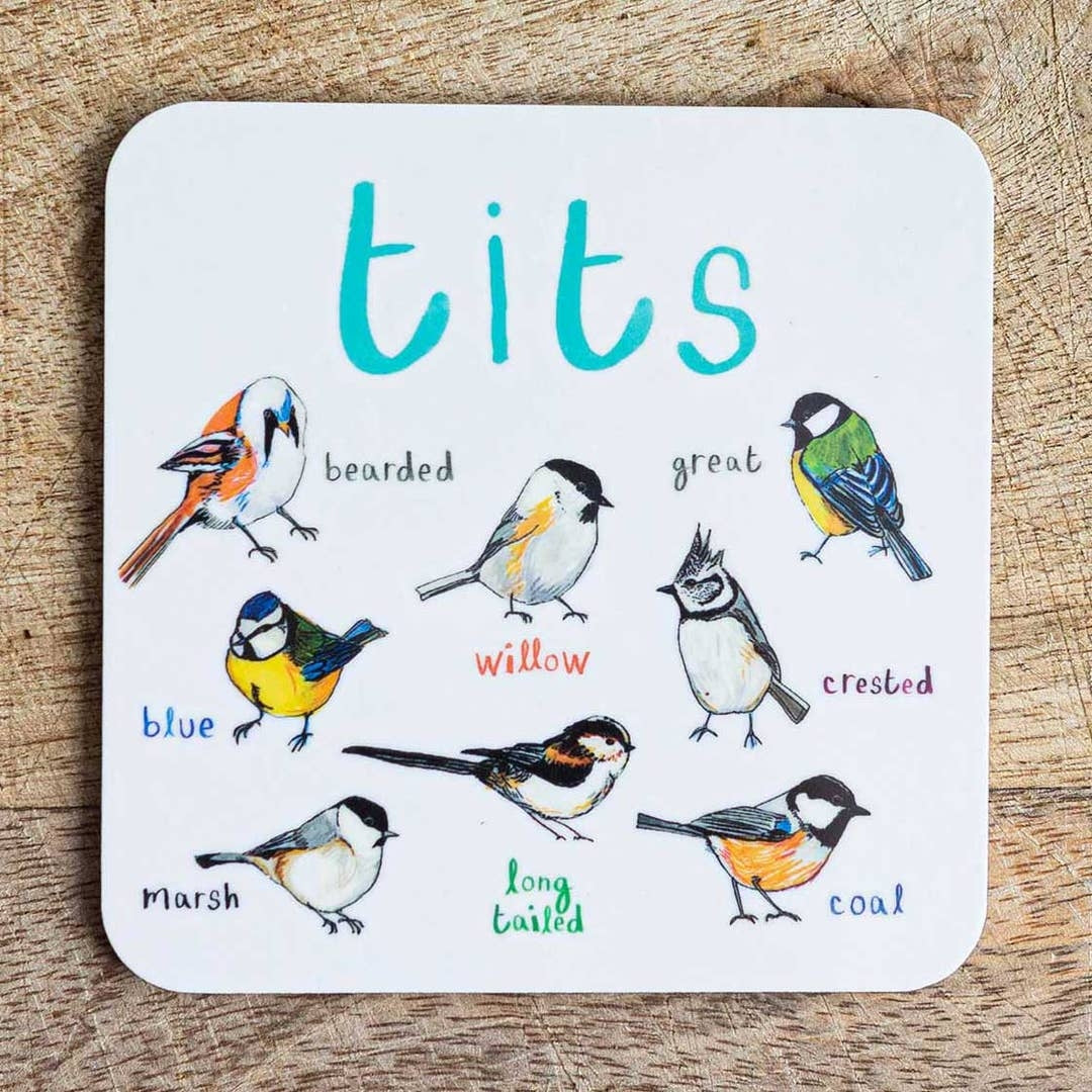 Coaster featuring illustrations of birds on a white background. Each bird is labelled, while the text 'Tits' is printed on the top. The coaster sits on a wooden surface.