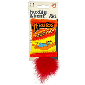 An orange, red and yellow novelty cat toy designed to look like a pack of Cheetos chips.  The logo for 'Treatos' is printed at the top of the toy. An illustration of a flying cat wearing a cape and glasses is pictured under the logo, along with the text 'Flamin Fast'. A red fluffy ball is attached to the bottom of the toy.