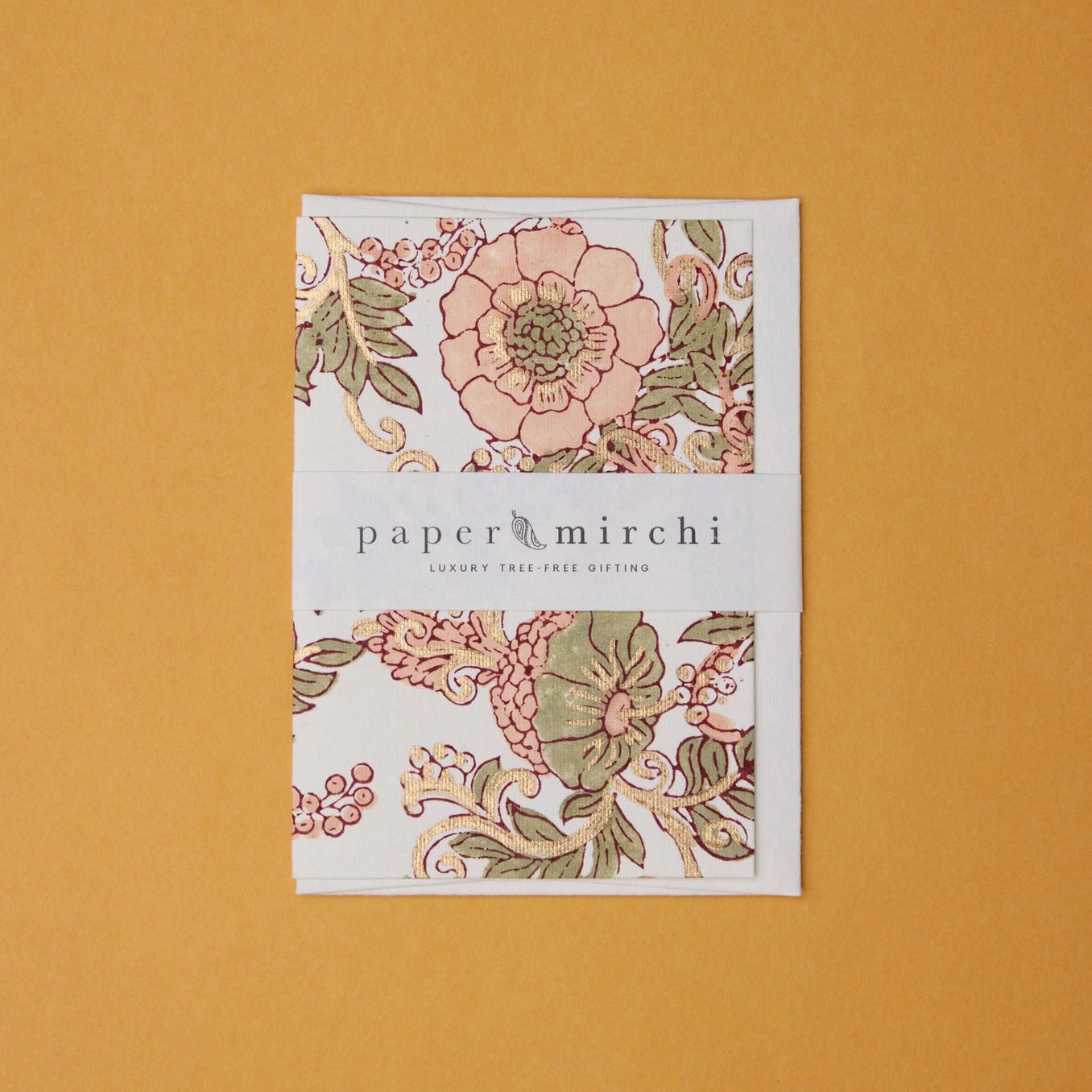 Cotton paper greeting card with a pink, green and gold botanical design on a yellow background. 