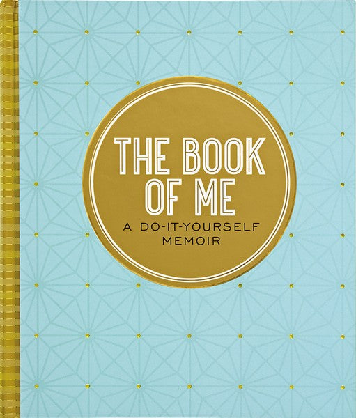 light blue book with gold details. in a centered gold circle reads the following text "the book of me a do-it-yourself memoir"