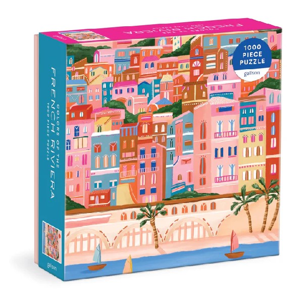 blue an pink puzzle box. the cover shows a bright illustration of a coastline town