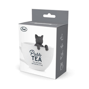 tea infuser in the shape of a black cat propping its head above a white tea cup