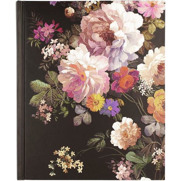 black notebook with light-coloured flowers coming out of the right side of the cover