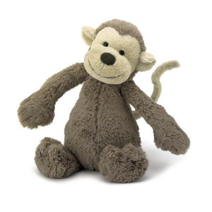 adorably soft plushie of a medium-sized brown-grey monkey by popular brand Jellycat.